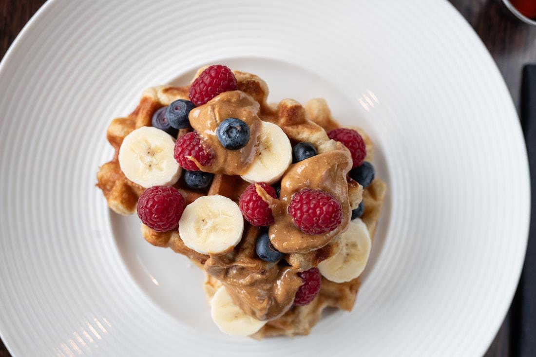 Waffles with berries, banana and nut butter